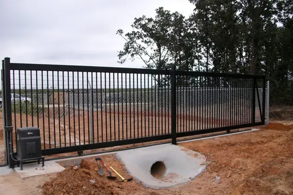 Black metal sliding gate with automatic opener